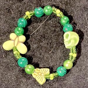 Hand-beaded w/ butterfly, skull, malachite, & glass bracelet